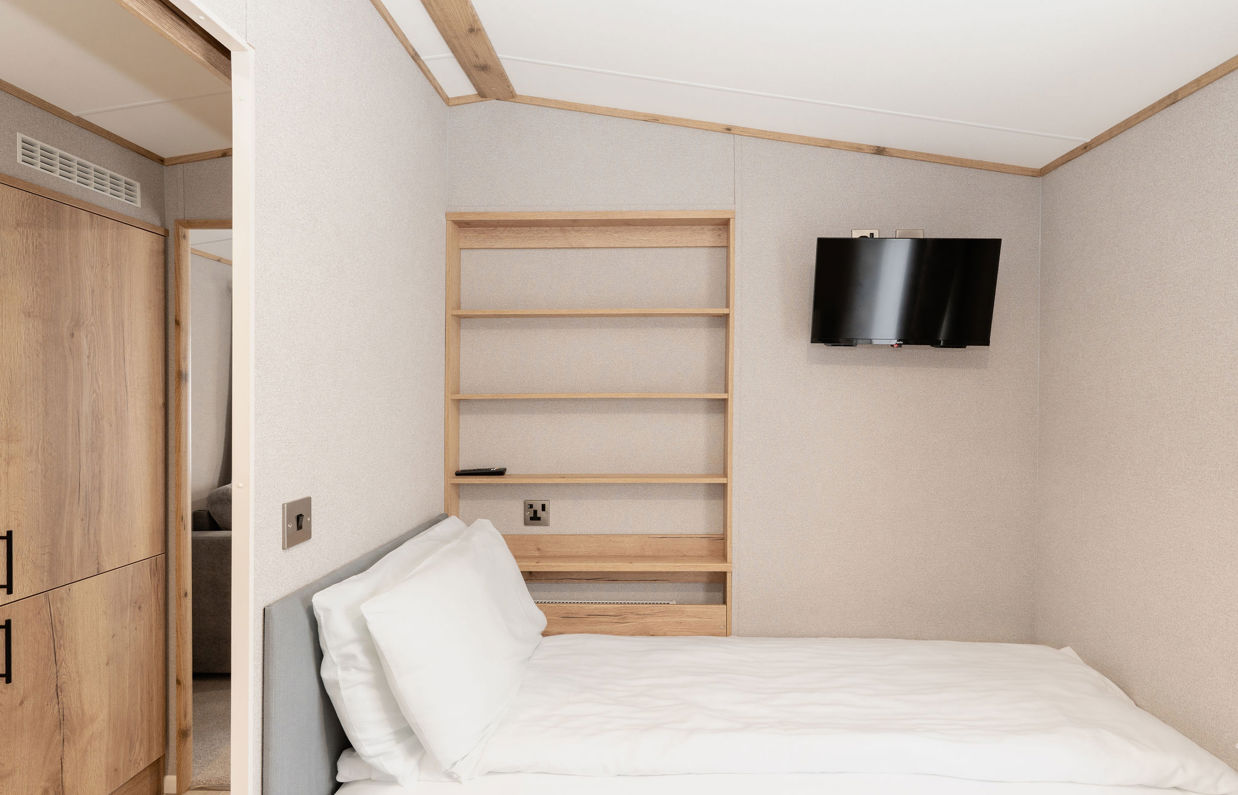 Internal of an accessible caravan spacious twin bedroom 