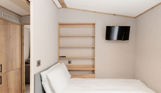 Internal of an accessible caravan spacious twin bedroom 