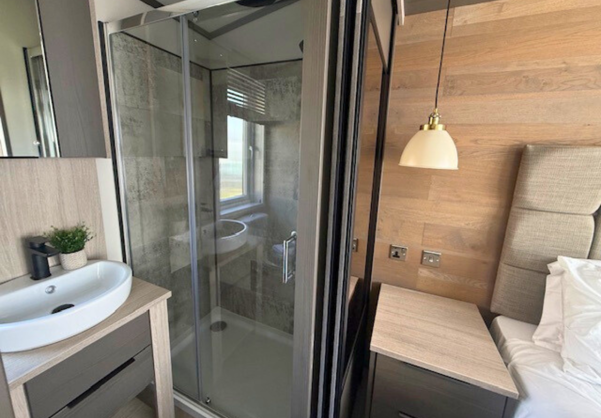 Internal of a lodge bedroom with ensuite included