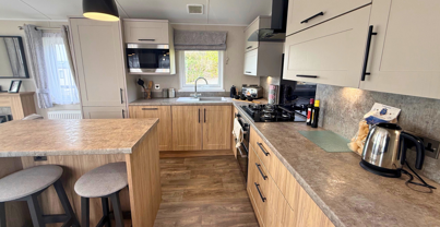 Internal of a caravan kitchen with breakfast bar