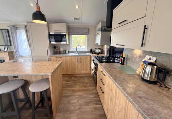 Internal of a caravan kitchen with breakfast bar