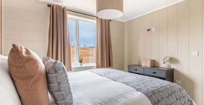 Internal of a luxury lodge master bedroom with dressing area