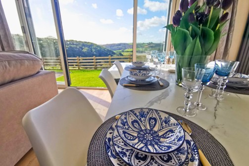 Internal of a luxury lodge dining area with countryside views