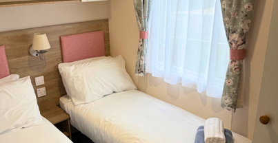 Internal of a caravan twin bedroom