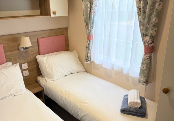 Internal of a caravan twin bedroom