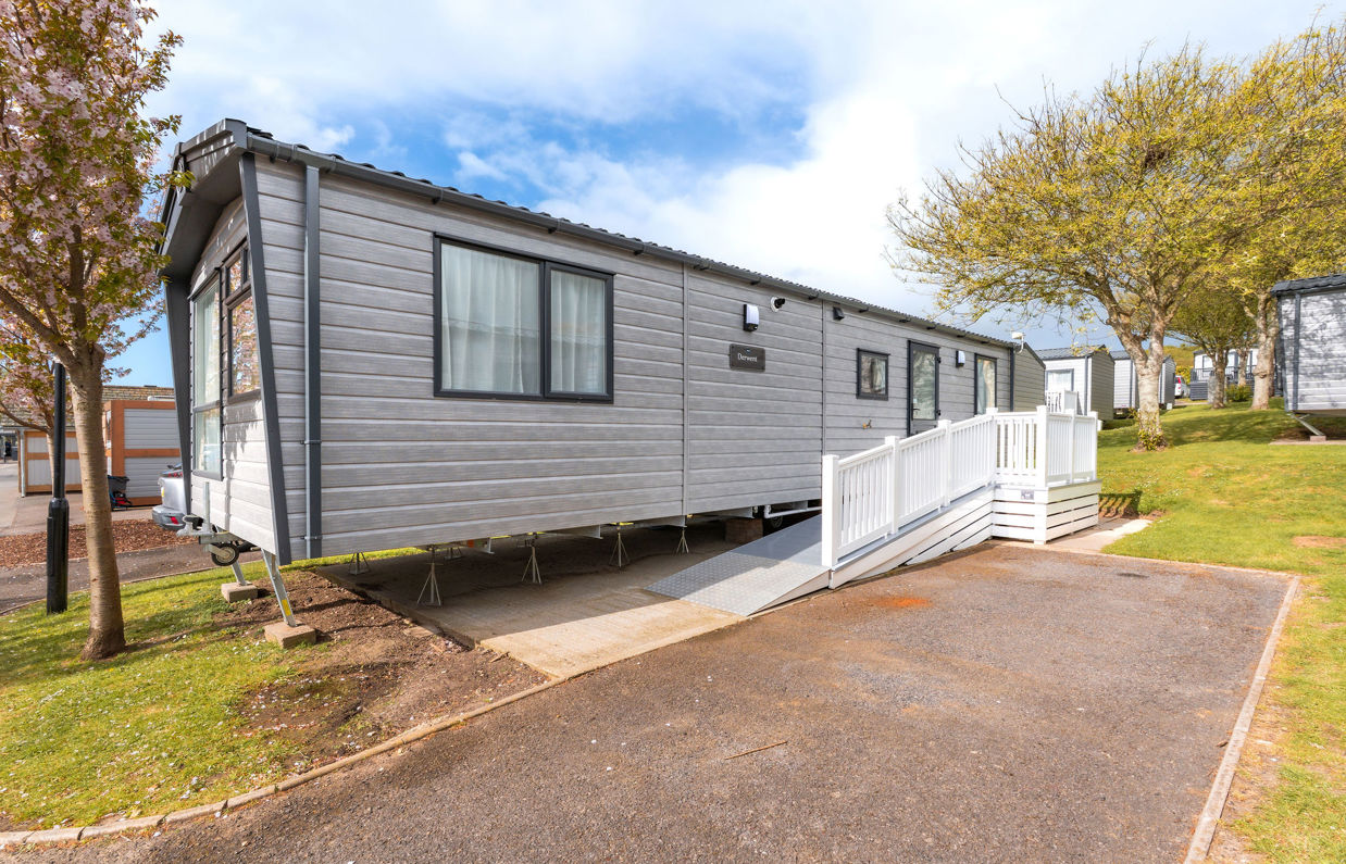 External of an accessible caravan ramp to entrance with decking