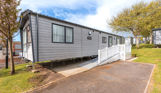 External of an accessible caravan ramp to entrance with decking