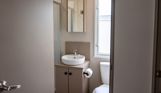 Internal of a caravan bathroom with shower, toilet and sink