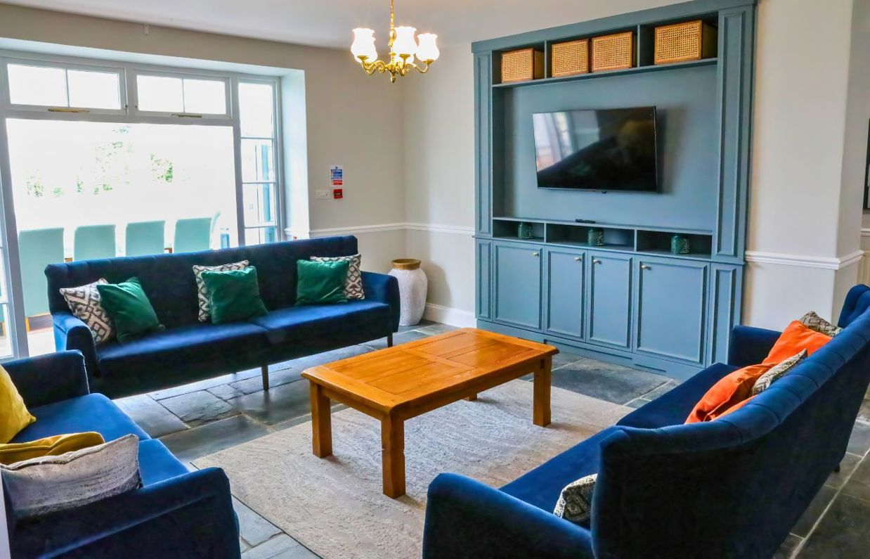 Internal of a manor house open lounge with wall mounted tv