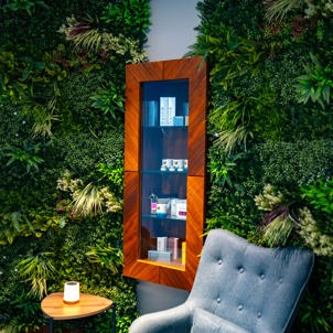 A peaceful spa waiting room with comfy chairs, products and cosy decór