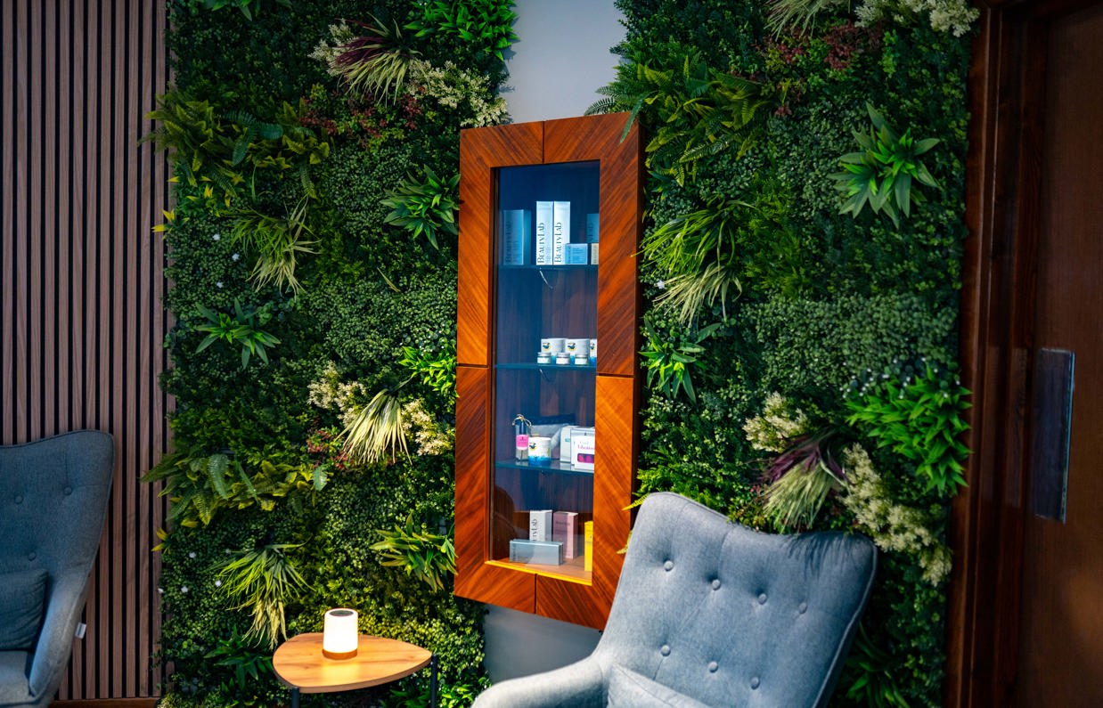 A peaceful spa waiting room with comfy chairs, products and cosy decór