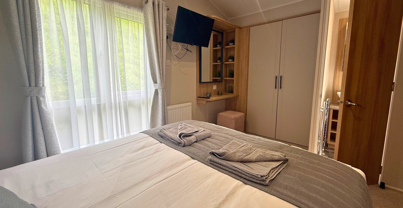 Internal of a caravan master bedroom with ensuite