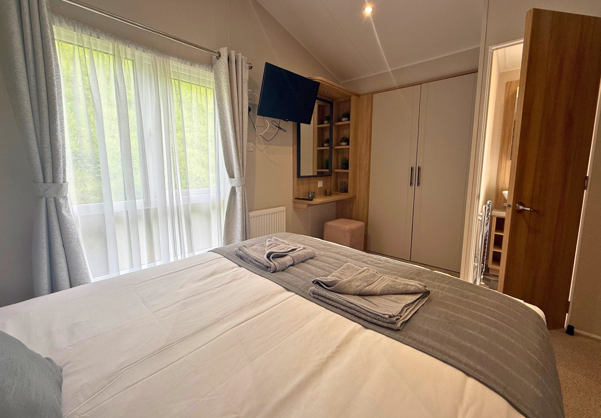 Internal of a caravan master bedroom with ensuite