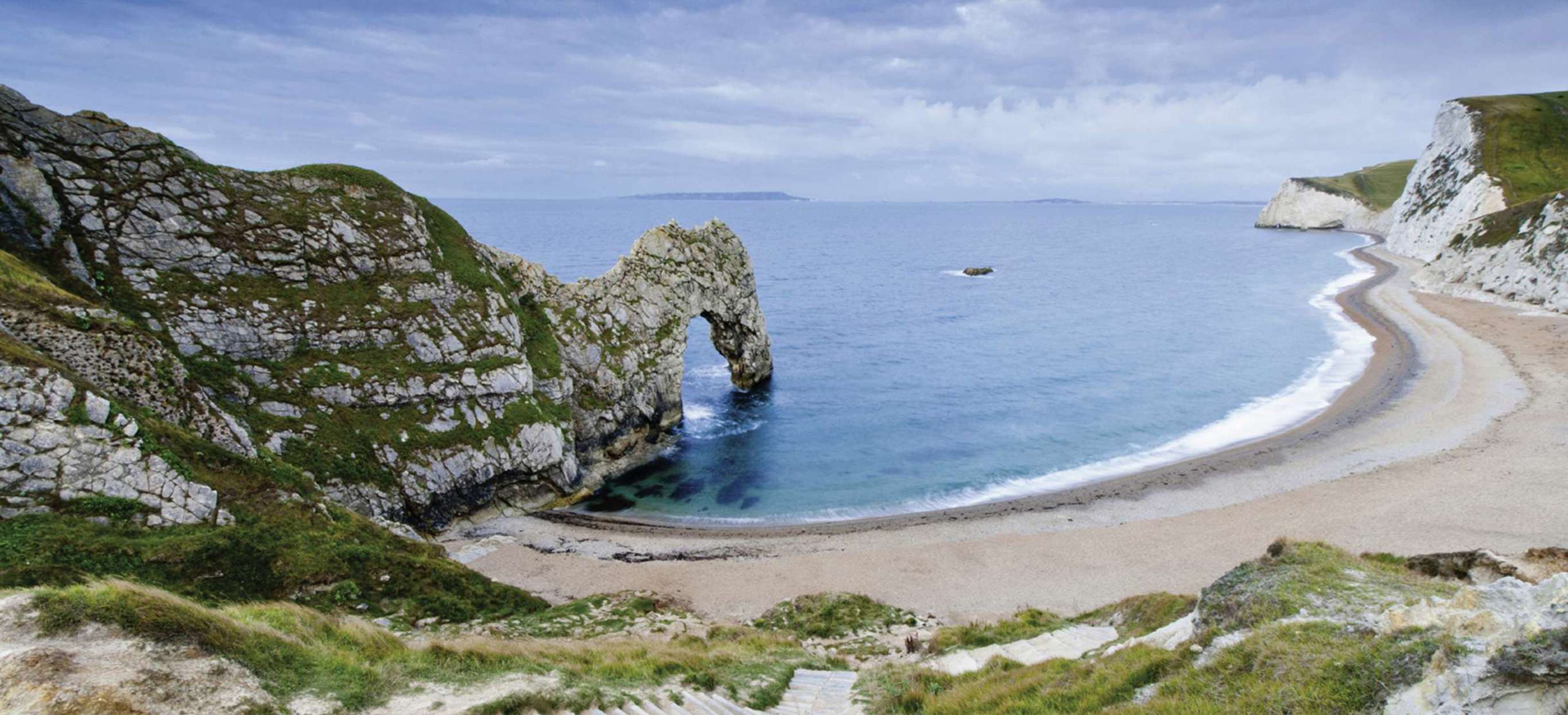 The famous natural limestone arch along the Jurassic Coast of Durdle Door Beach