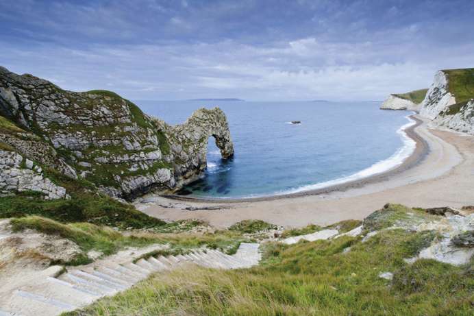 The famous natural limestone arch along the Jurassic Coast of Durdle Door Beach
