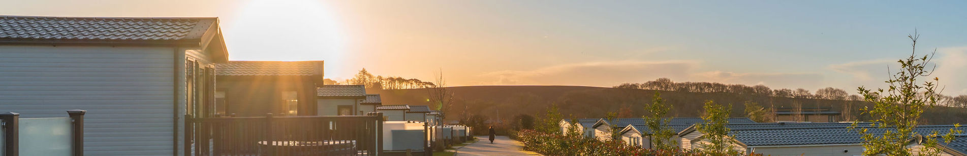 Holiday homes on park at sunset