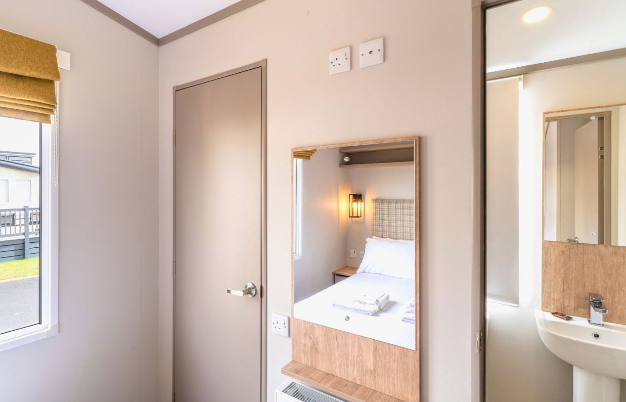 Internal of a caravan master bedroom with ensuite