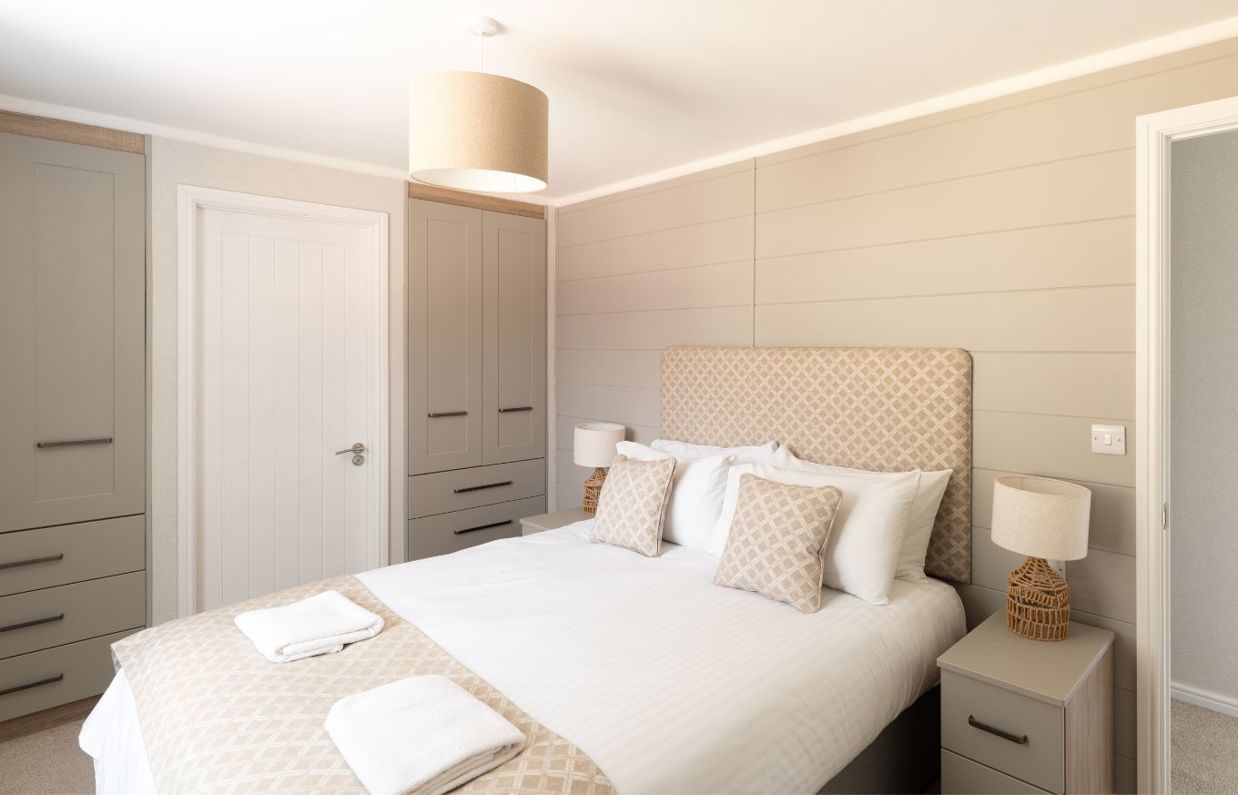 Internal of a lodge master bedroom with storage