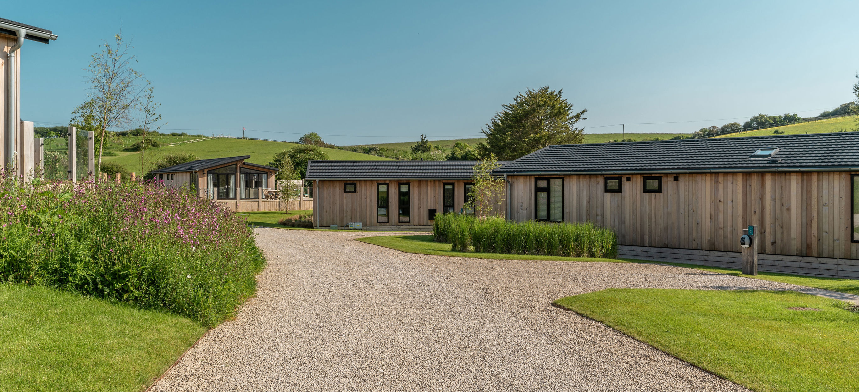 Luxury lodges among woodland and rolling hills at The Stables at Bowleaze Cove Holiday Park & Spa