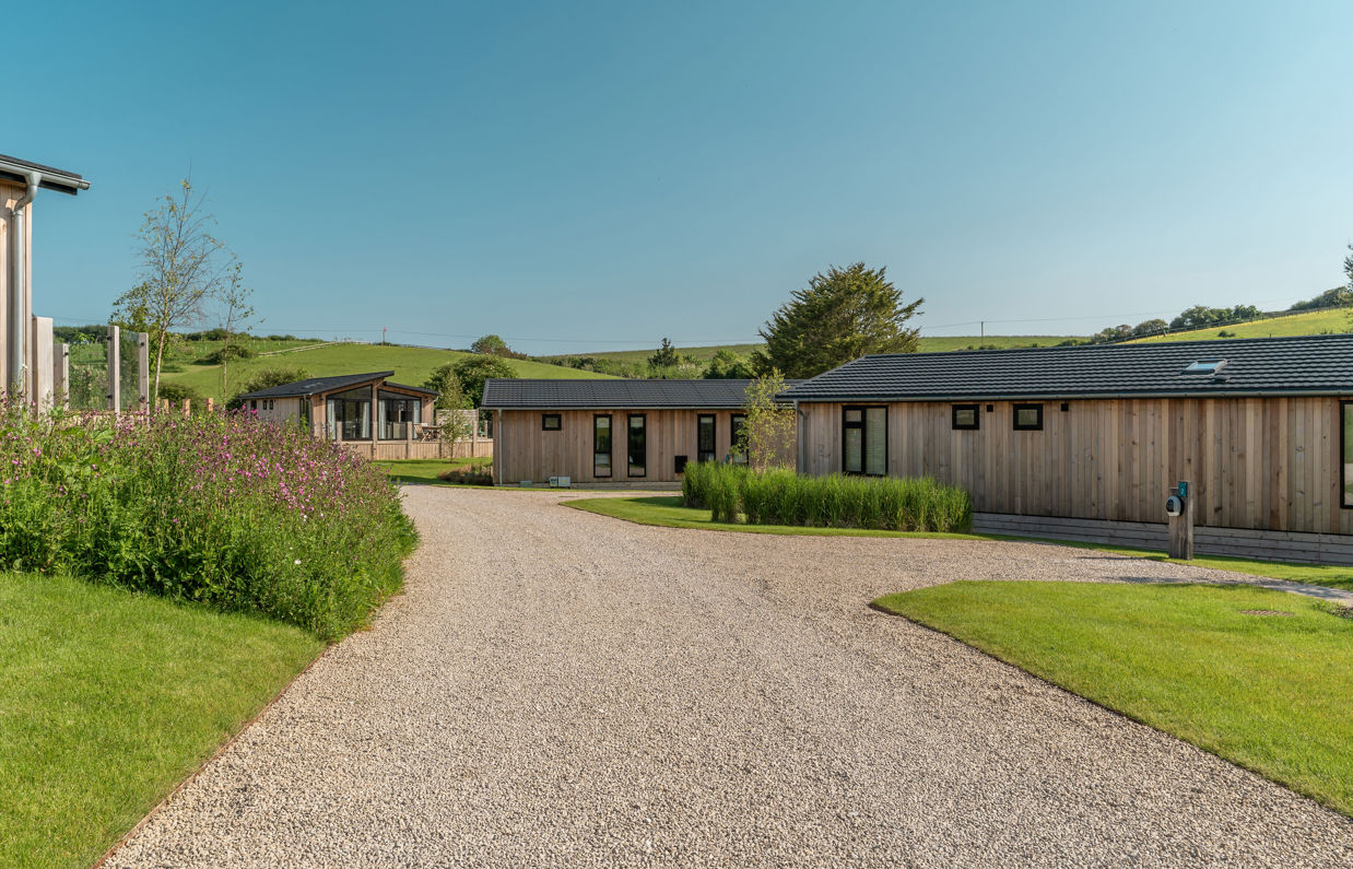 Luxury lodges among woodland and rolling hills at The Stables at Bowleaze Cove Holiday Park & Spa