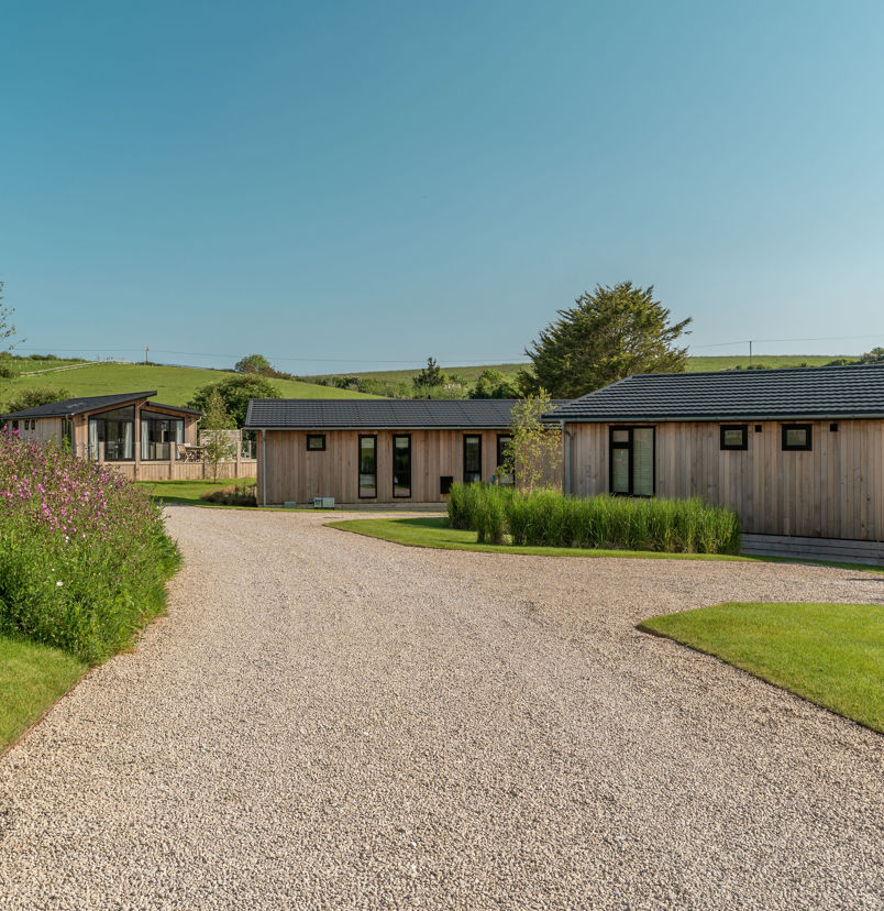 Luxury lodges among woodland and rolling hills at The Stables at Bowleaze Cove Holiday Park & Spa