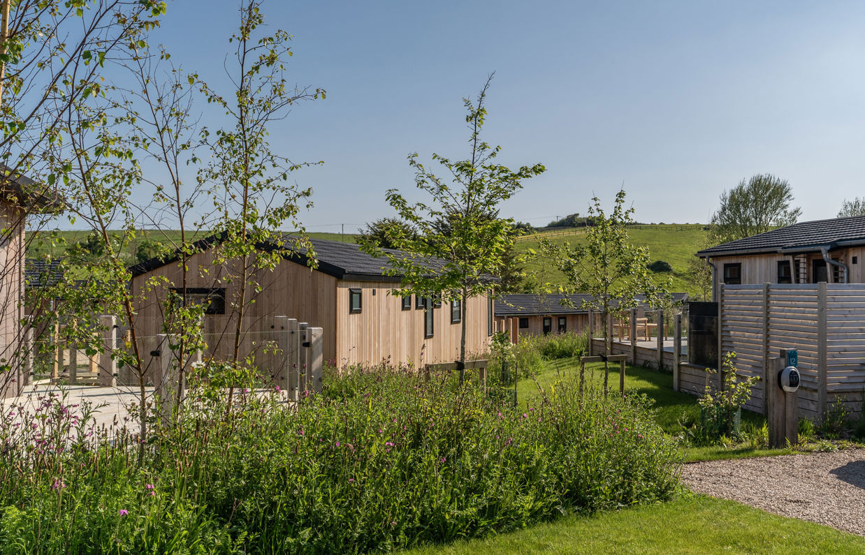 Luxury lodges among woodland and rolling hills at The Stables at Bowleaze Cove Holiday Park & Spa