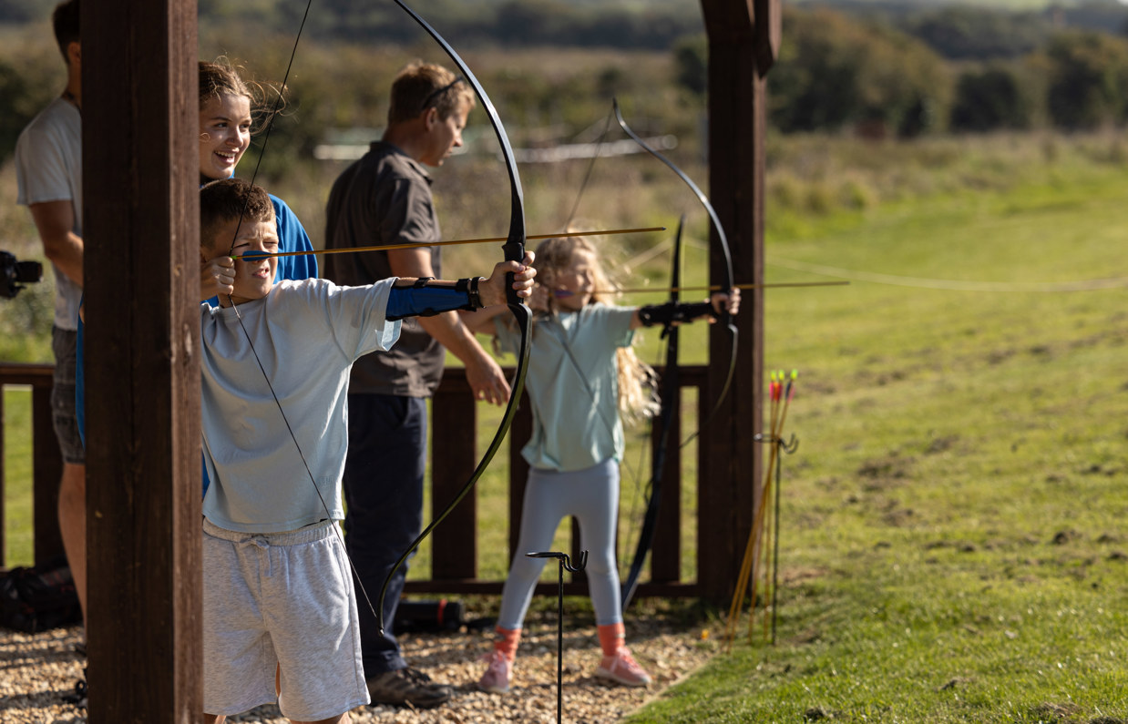 Kids taking aim during archery class