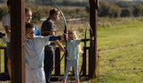 Kids taking aim during archery class