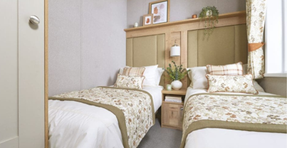 Internal of a caravan twin bedroom