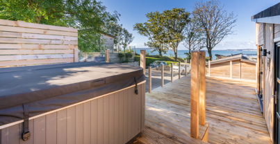 Raised hot tub looking out to the sea and Portland