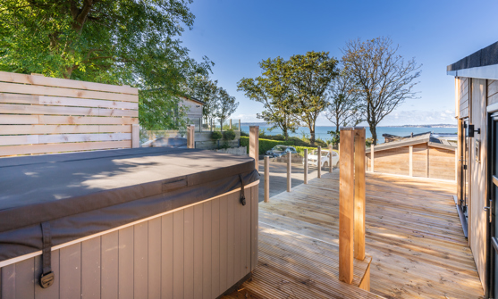 Raised hot tub looking out to the sea and Portland