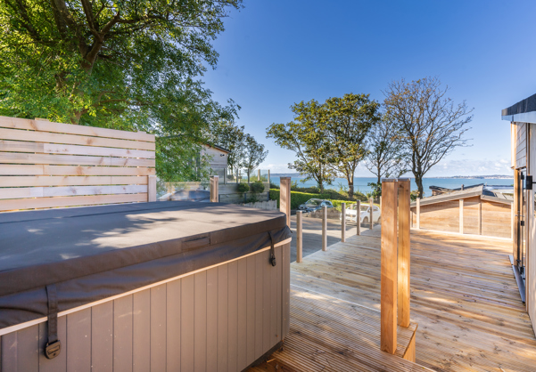 Raised hot tub looking out to the sea and Portland