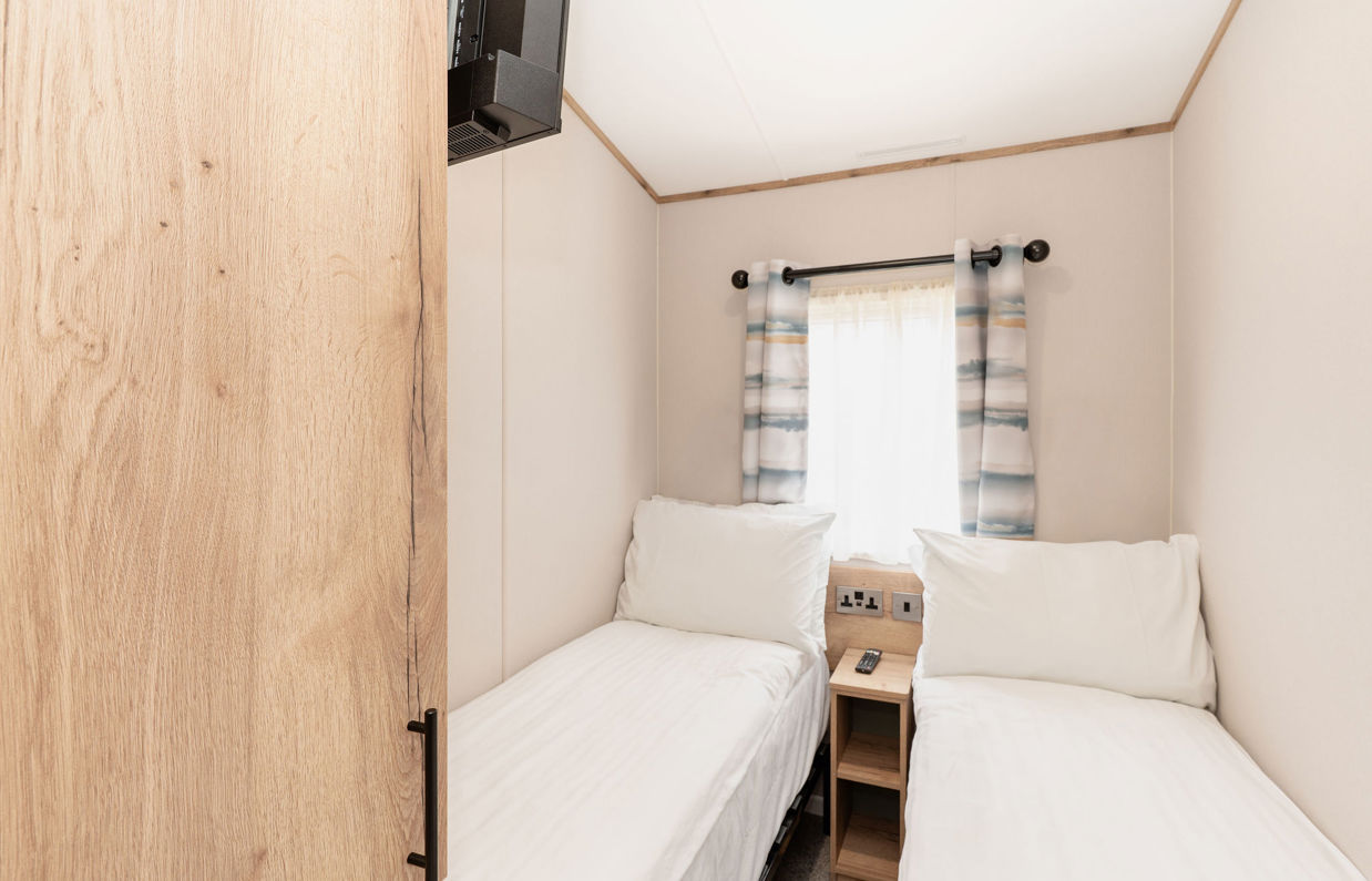 Internal of a caravan twin bedroom