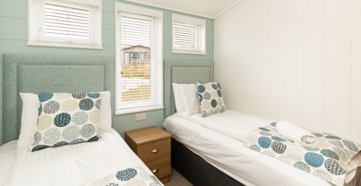 Internal of a luxury lodge twin bedroom