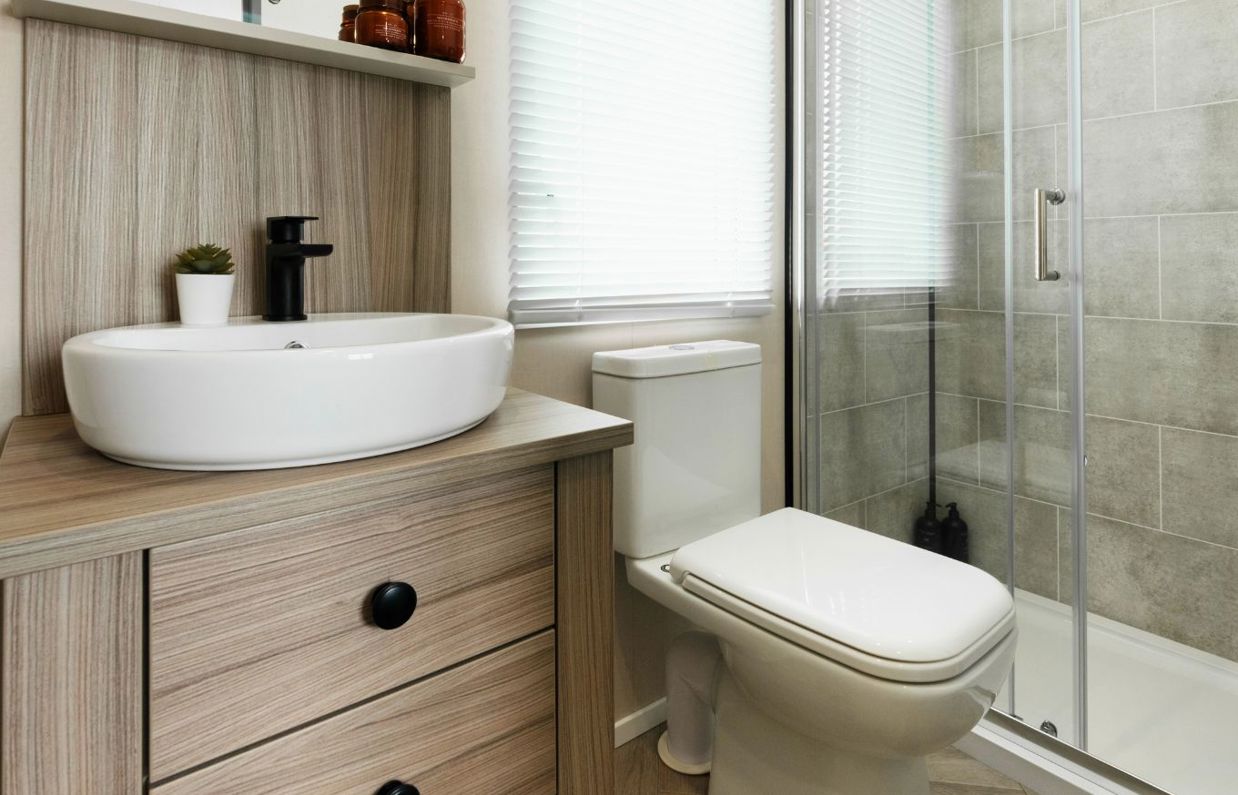 Internal of a caravan bathroom with toilet and sink