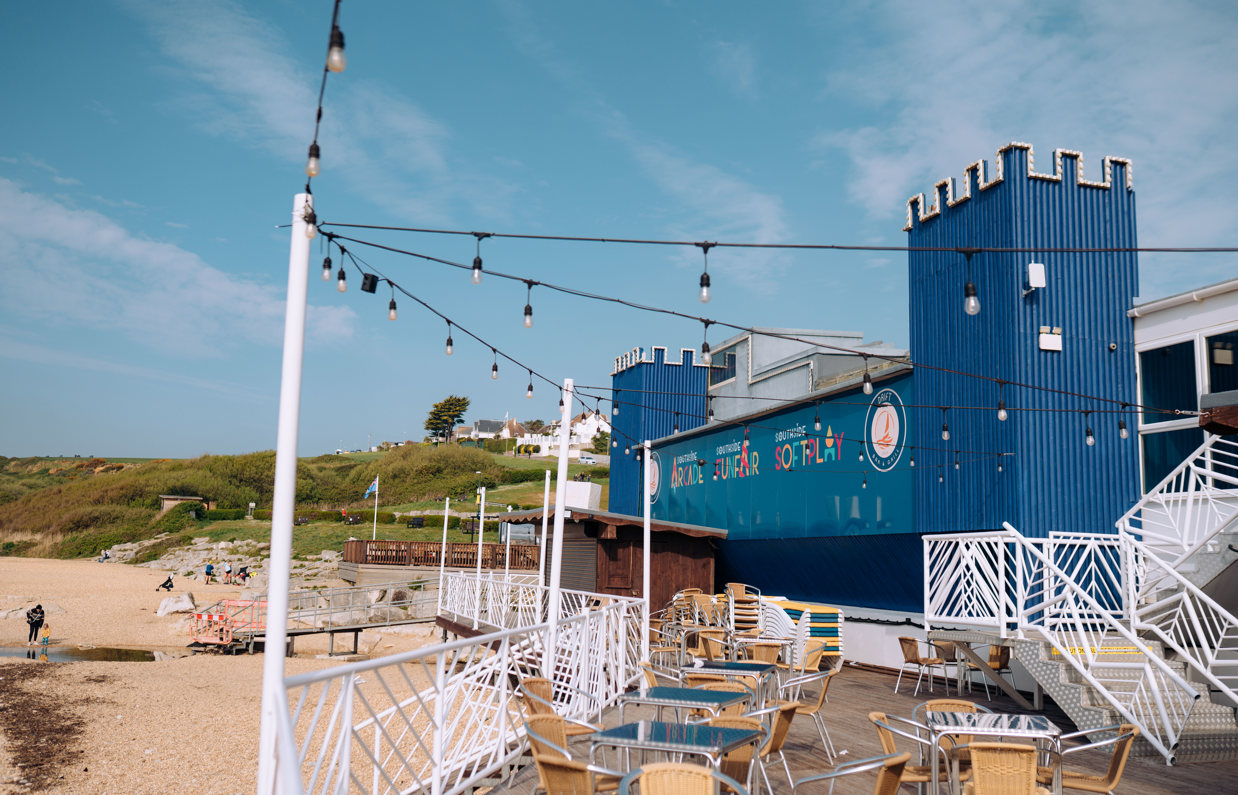 Outside terrace beachside seating of Drift Bar & Grill adjacent to Southside Funfair, Arcade and Soft Play