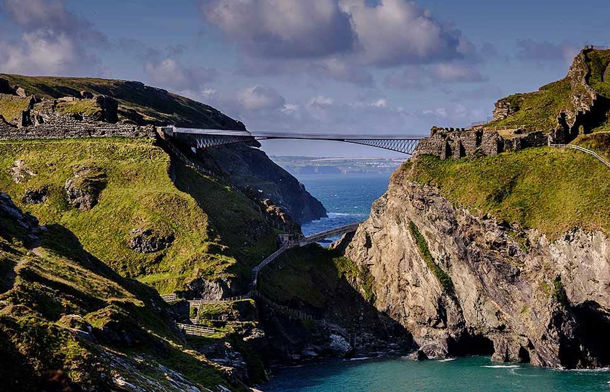 A rocky cliff section connected by a bridge to a castle