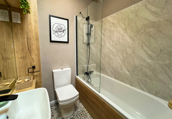 Internal of a caravan bathroom with shower over bath 