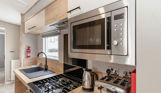 Internal of an accessible caravan open plan kitchen
