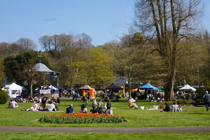 A market area in a park with a bandstand