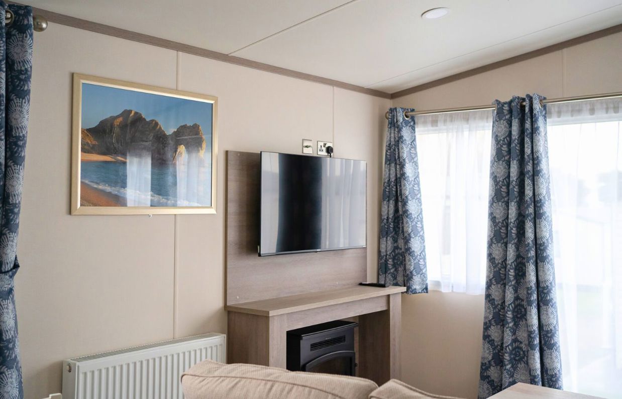 Internal of a caravan lounge with TV