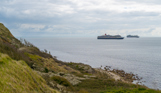 The view out to sea with cruise ships in the distance from Osmington Bay