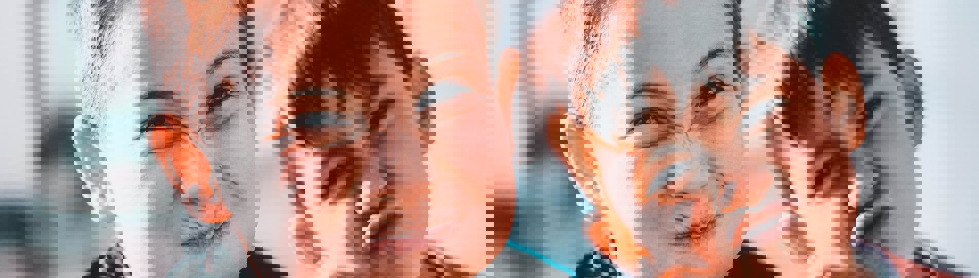 Two young boys pulling silly faces at the camera