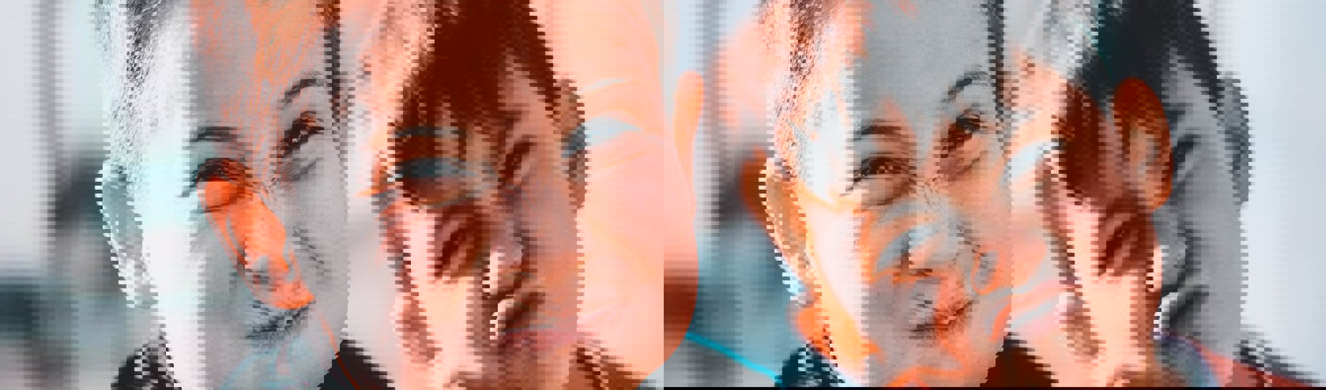 Two young boys pulling silly faces at the camera