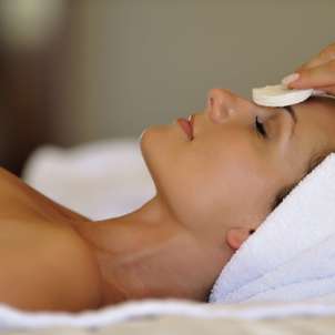 A lady laid down having a facial treatment