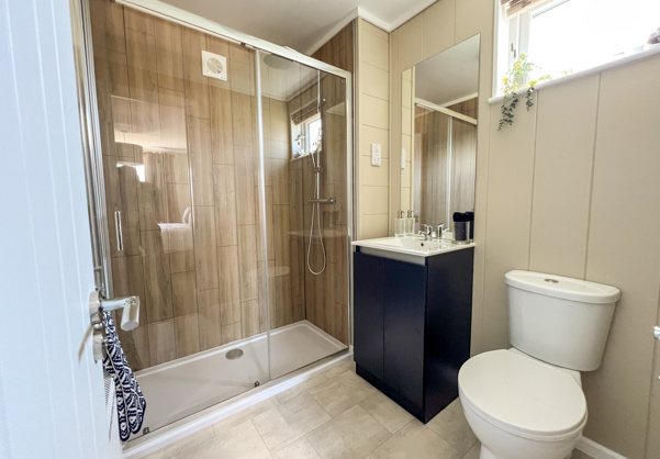 Internal of a luxury lodge ensuite bathroom with shower sink and toilet
