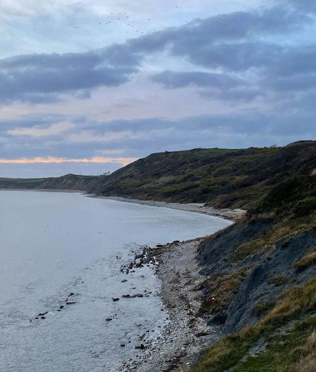 Osmington Beach, Hills and Coastal Walk on a cloudy day at sunset