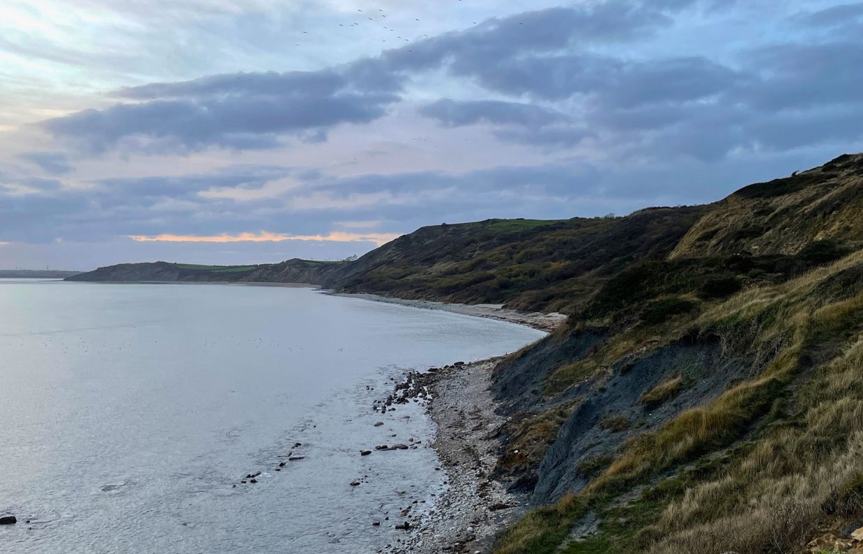 Osmington Beach, Hills and Coastal Walk on a cloudy day at sunset