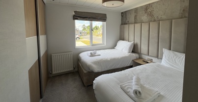 Twin bedroom with built in wardrobe