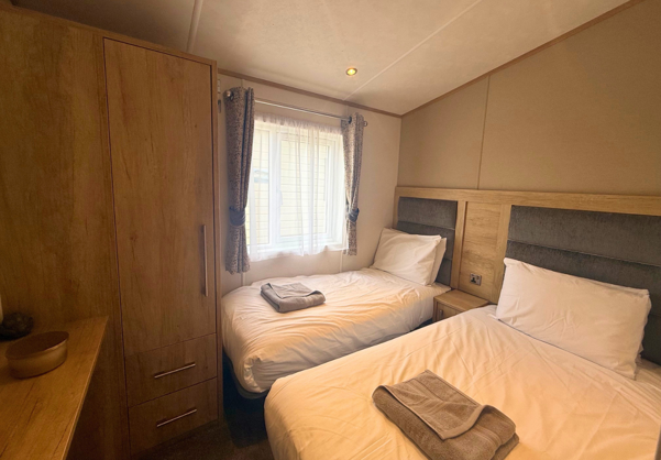 Internal of a caravan twin bedroom